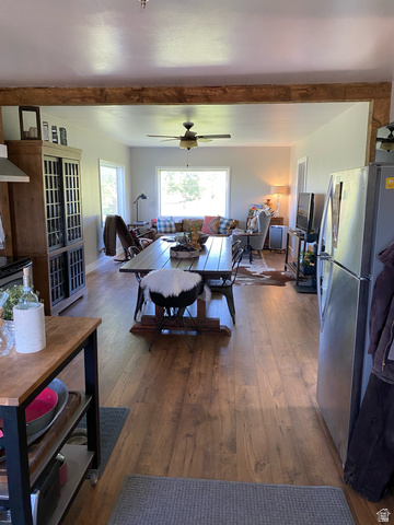 662 Earley Road Montpelier, ID 83254 - Photo 5 of 11 Living room with dark wood-style flooring, ceiling fan, and beam ceiling
