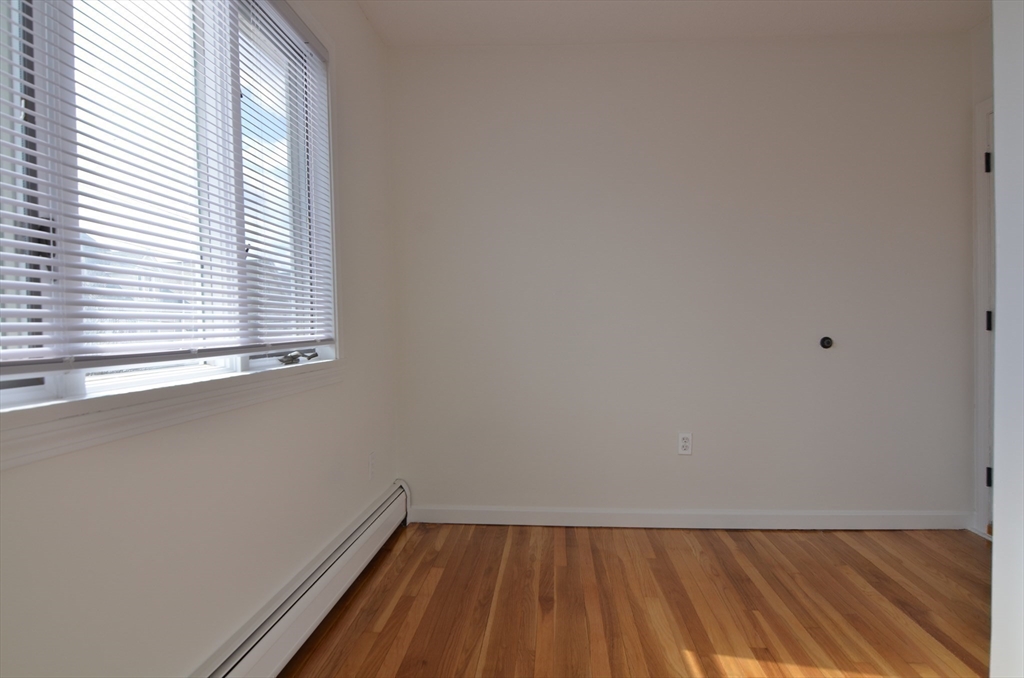 88 Cleveland Avenue, Unit 2 Everett, MA 02149 - Photo 11 of 23 an empty room with a window