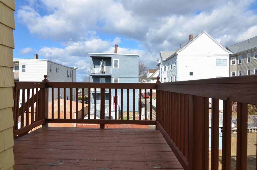 88 Cleveland Avenue, Unit 2 Everett, MA 02149 - Photo 12 of 23 a view of a house with wooden deck