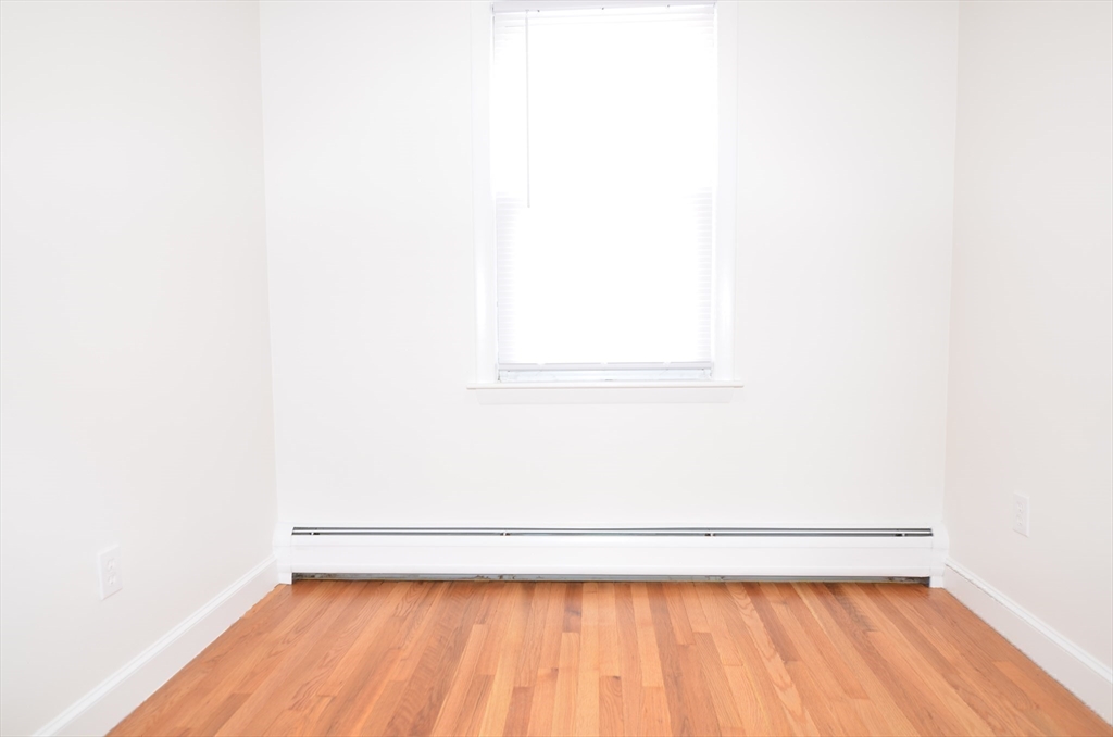 88 Cleveland Avenue, Unit 2 Everett, MA 02149 - Photo 20 of 23 a view of a small space with wooden floor
