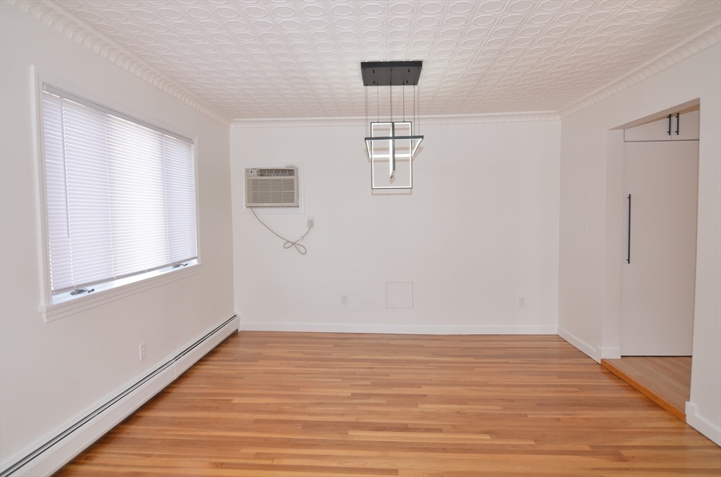 88 Cleveland Avenue, Unit 2 Everett, MA 02149 - Photo 9 of 23 a view of empty room with wooden floor