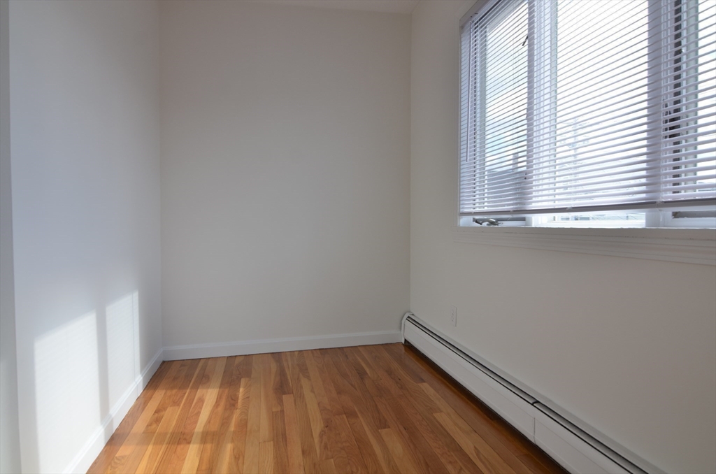 88 Cleveland Avenue, Unit 2 Everett, MA 02149 - Photo 10 of 23 a view of a room with wooden floor and window