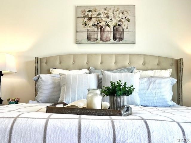 406 Calle Vista Torito San Clemente, CA 92672 - Photo 21 of 29 a bedroom with a bed and a potted plant