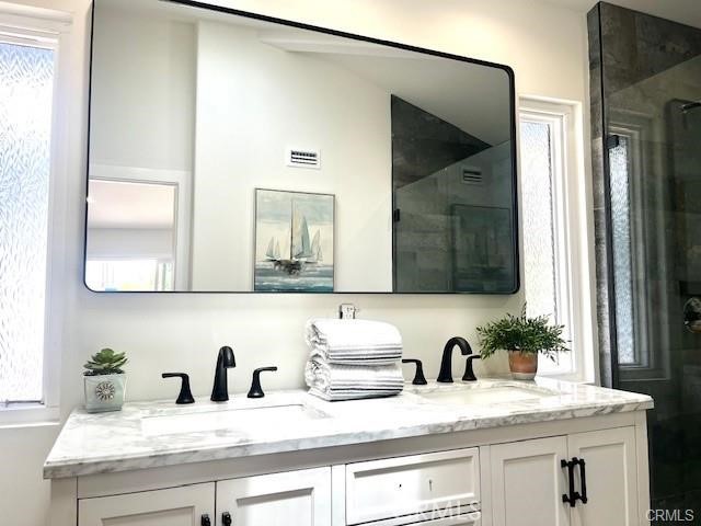 406 Calle Vista Torito San Clemente, CA 92672 - Photo 22 of 29 a bathroom with a granite countertop sink and a mirror