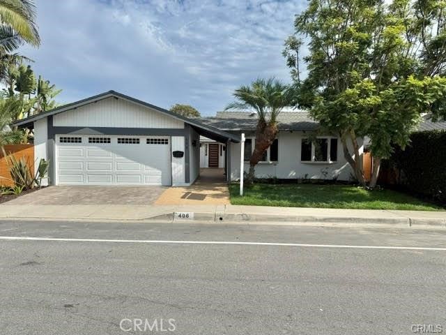 406 Calle Vista Torito San Clemente, CA 92672 - Photo 29 of 29 a front view of a house with a yard and garage