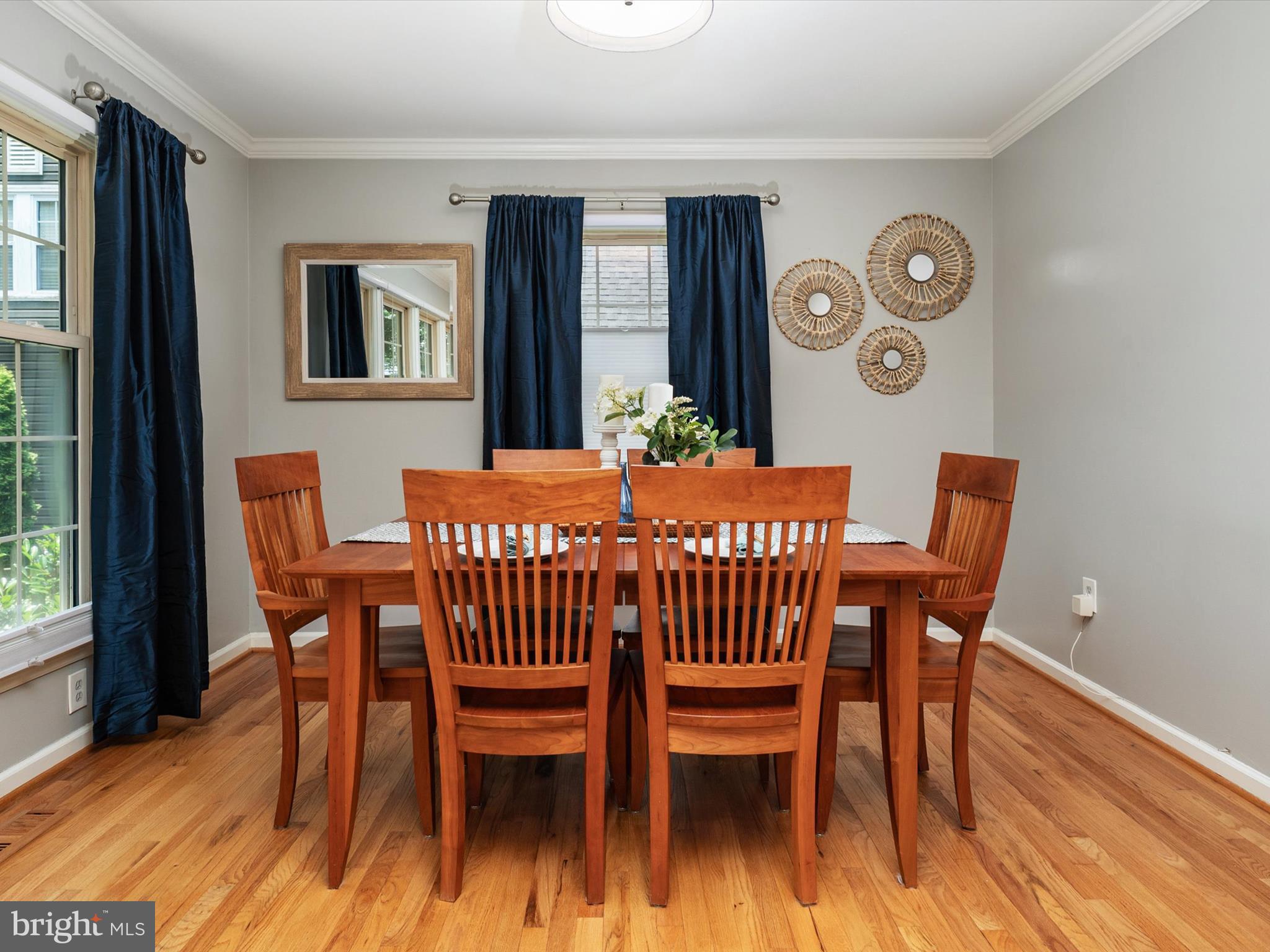 1589 Crofton Parkway Crofton, MD 21114 - Photo 12 of 60 a dining room with furniture a window and wooden floor