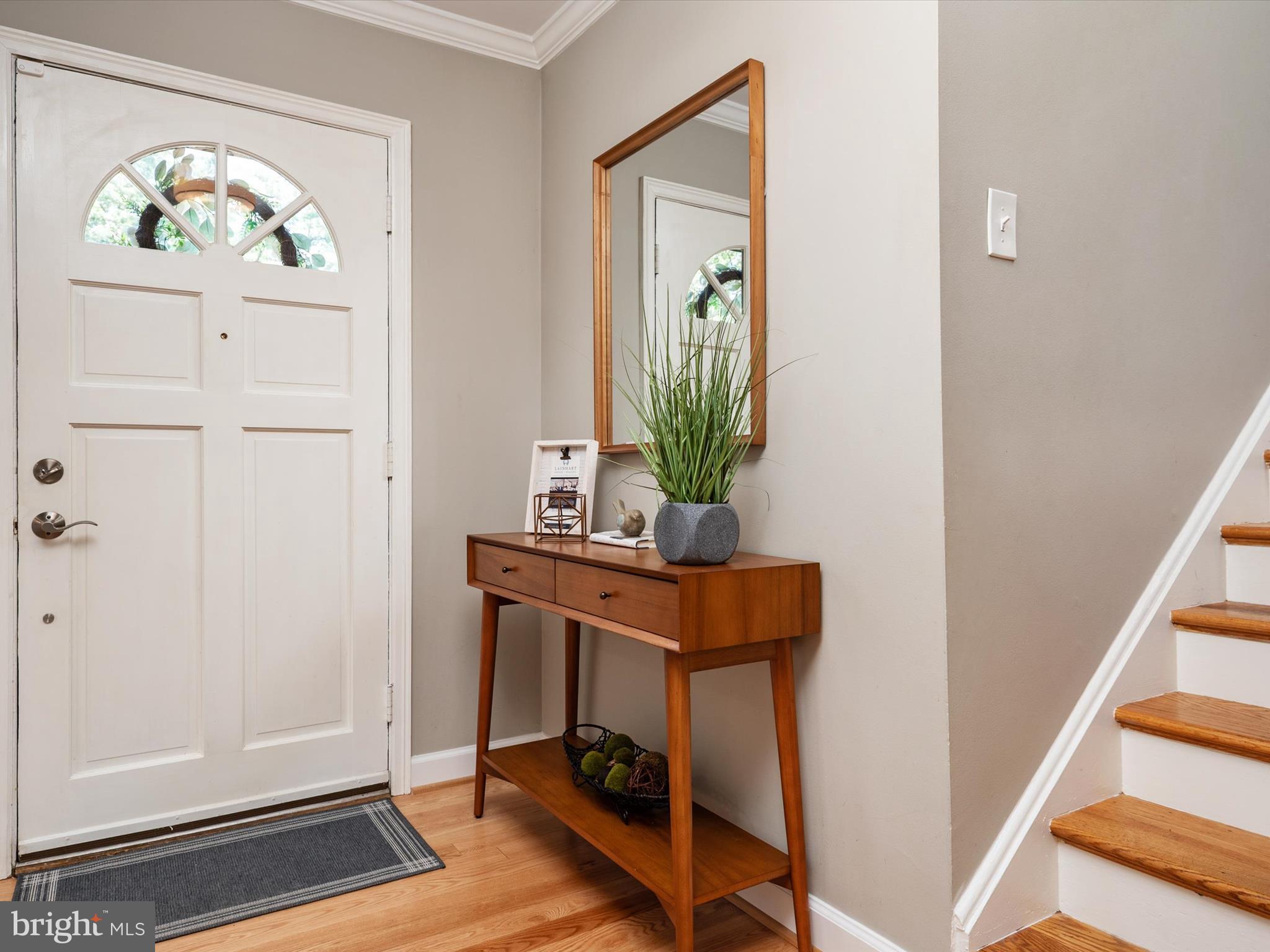 1589 Crofton Parkway Crofton, MD 21114 - Photo 13 of 60 a view of front door with wooden floor