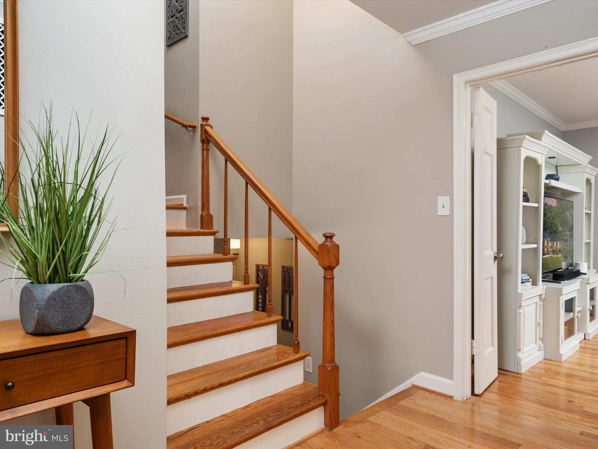 1589 Crofton Parkway Crofton, MD 21114 - Photo 14 of 60 a view of entryway and hall with wooden floor