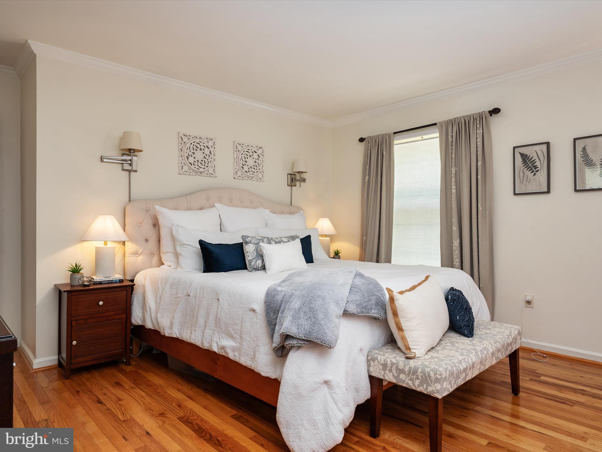 1589 Crofton Parkway Crofton, MD 21114 - Photo 15 of 60 a bedroom with a bed and wooden floor
