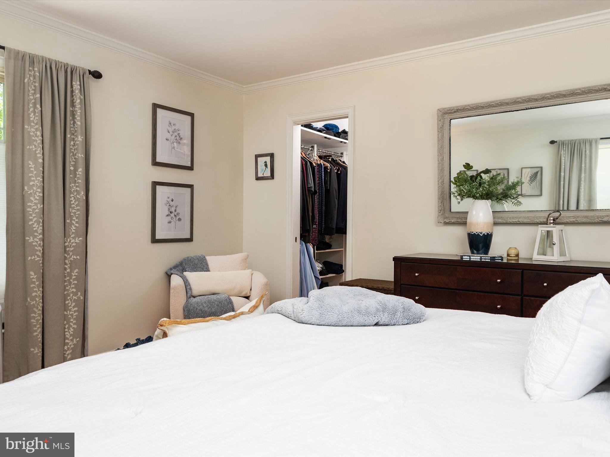 1589 Crofton Parkway Crofton, MD 21114 - Photo 16 of 60 a bedroom with a bed and a large mirror