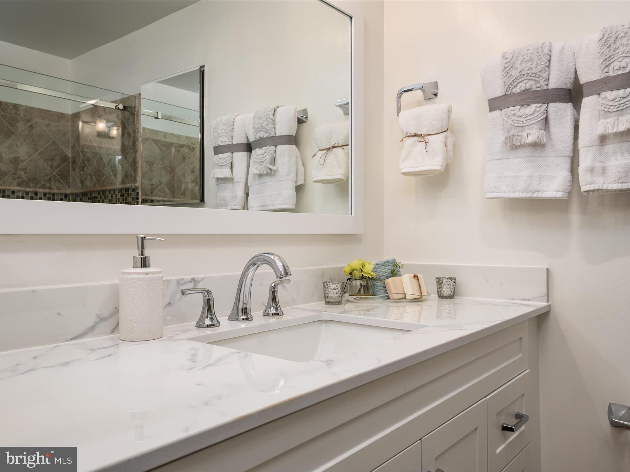 1589 Crofton Parkway Crofton, MD 21114 - Photo 17 of 60 a bathroom with a sink and a mirror