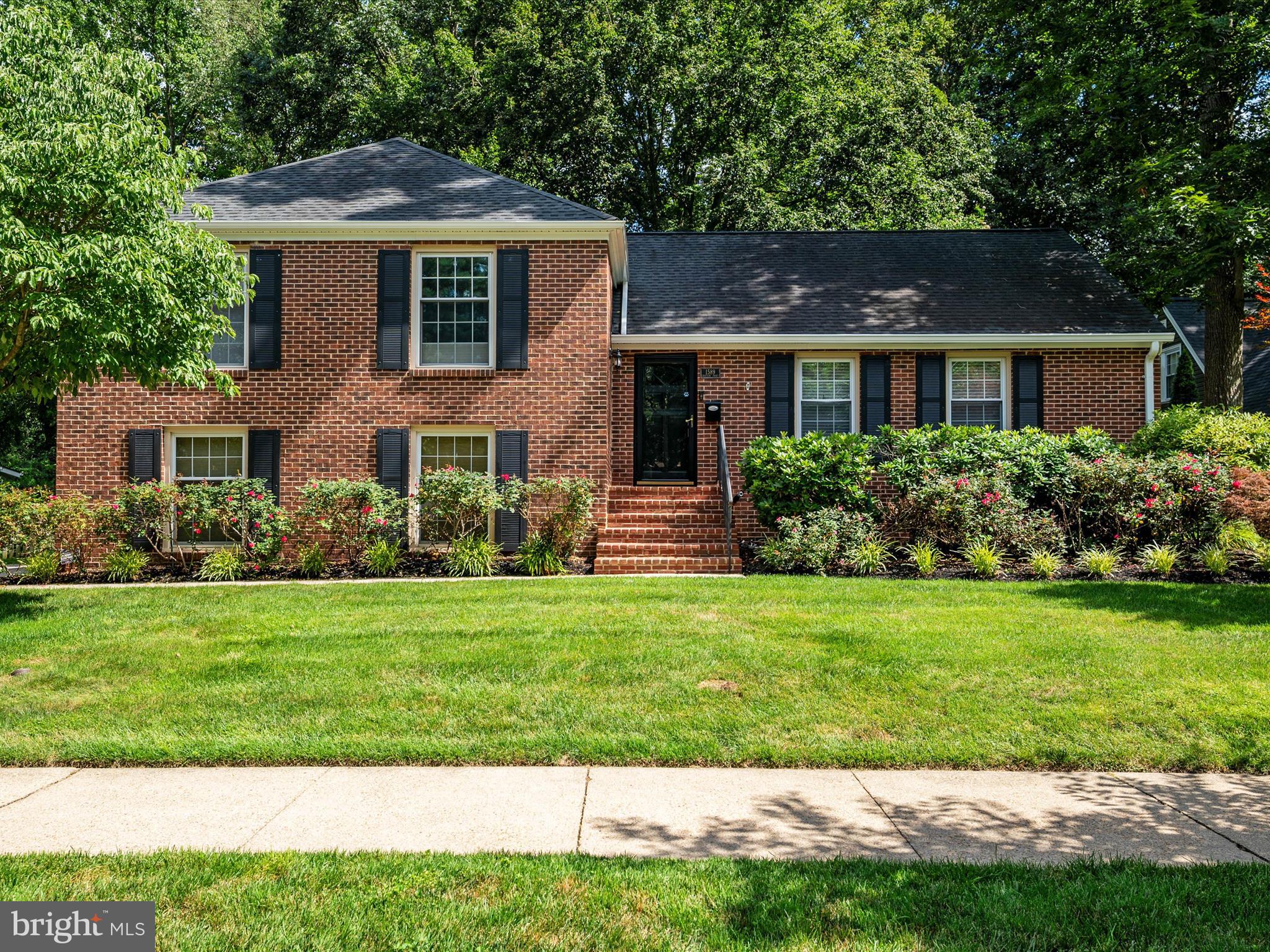1589 Crofton Parkway Crofton, MD 21114 - Photo 2 of 60 a front view of a house with a yard