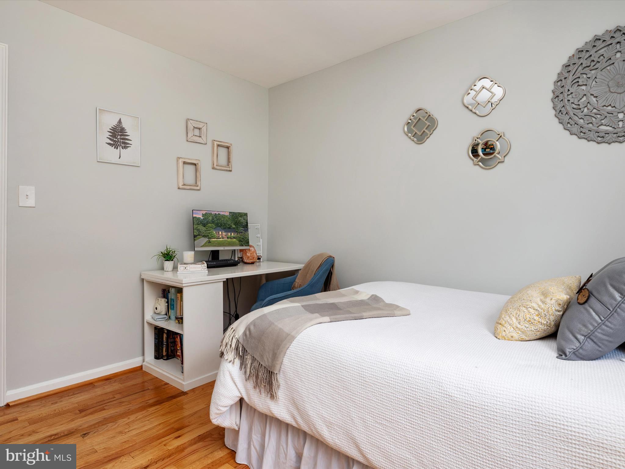 1589 Crofton Parkway Crofton, MD 21114 - Photo 22 of 60 a bedroom with a bed and a table in it