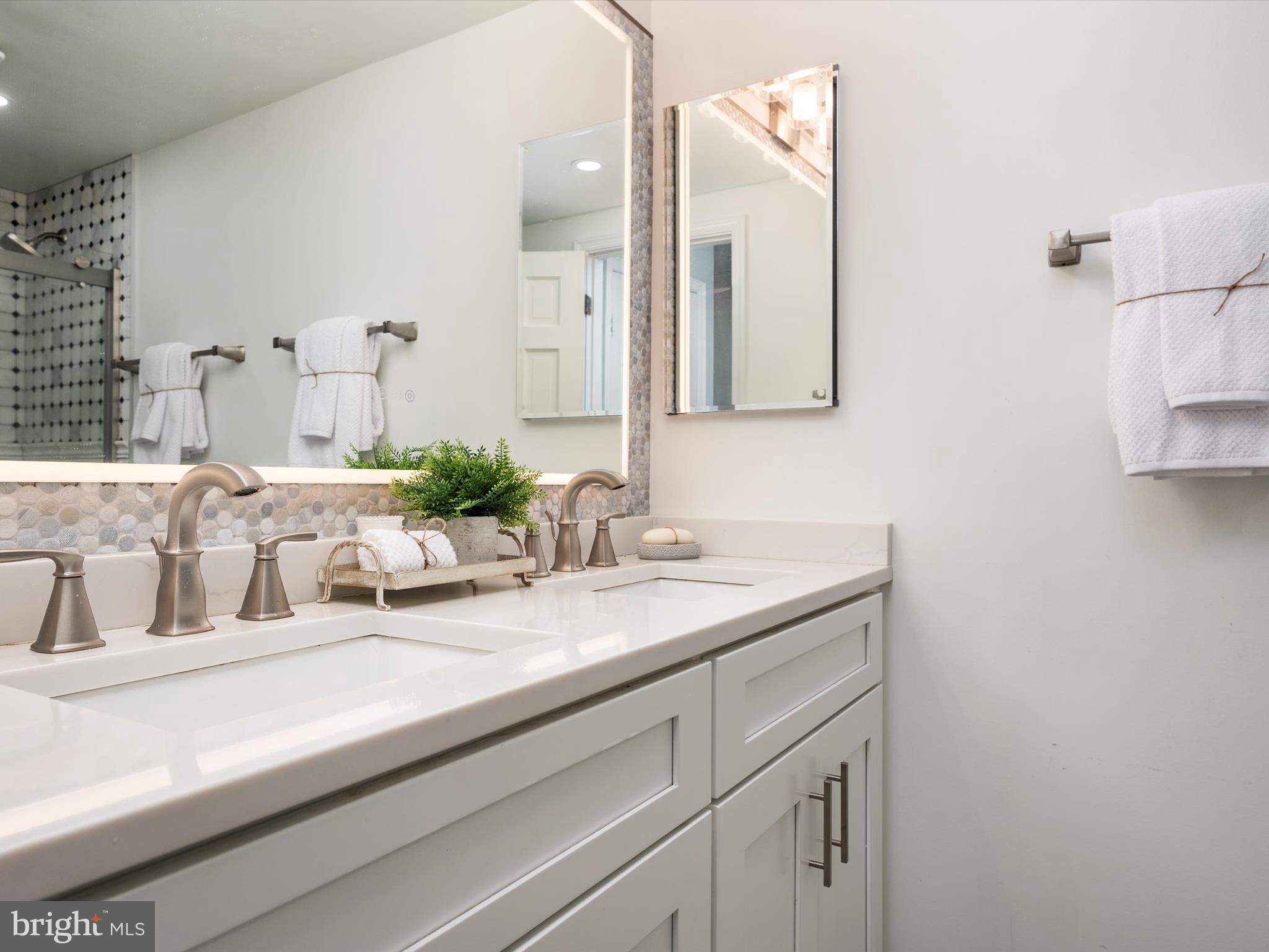 1589 Crofton Parkway Crofton, MD 21114 - Photo 23 of 60 a bathroom with a sink and mirror