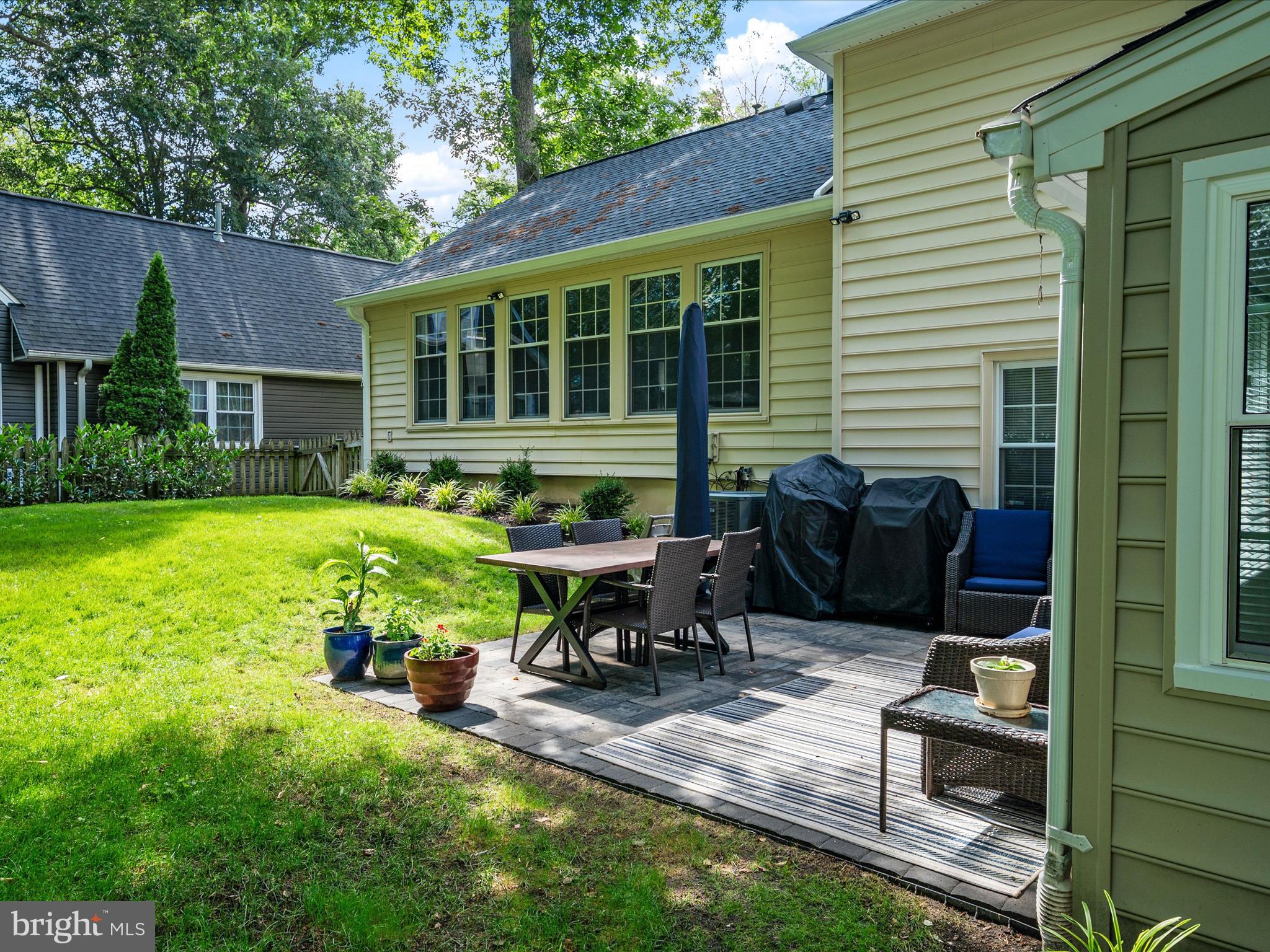 1589 Crofton Parkway Crofton, MD 21114 - Photo 35 of 60 a view of a house with backyard sitting area and garden