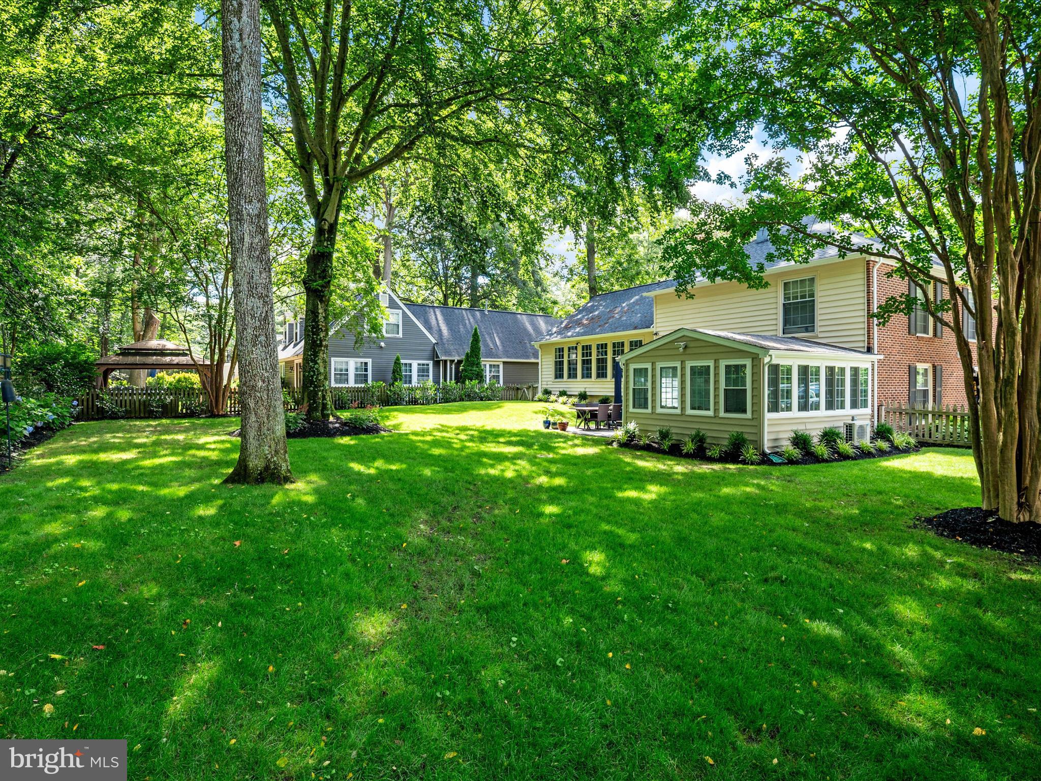1589 Crofton Parkway Crofton, MD 21114 - Photo 39 of 60 a front view of a house with yard and green space