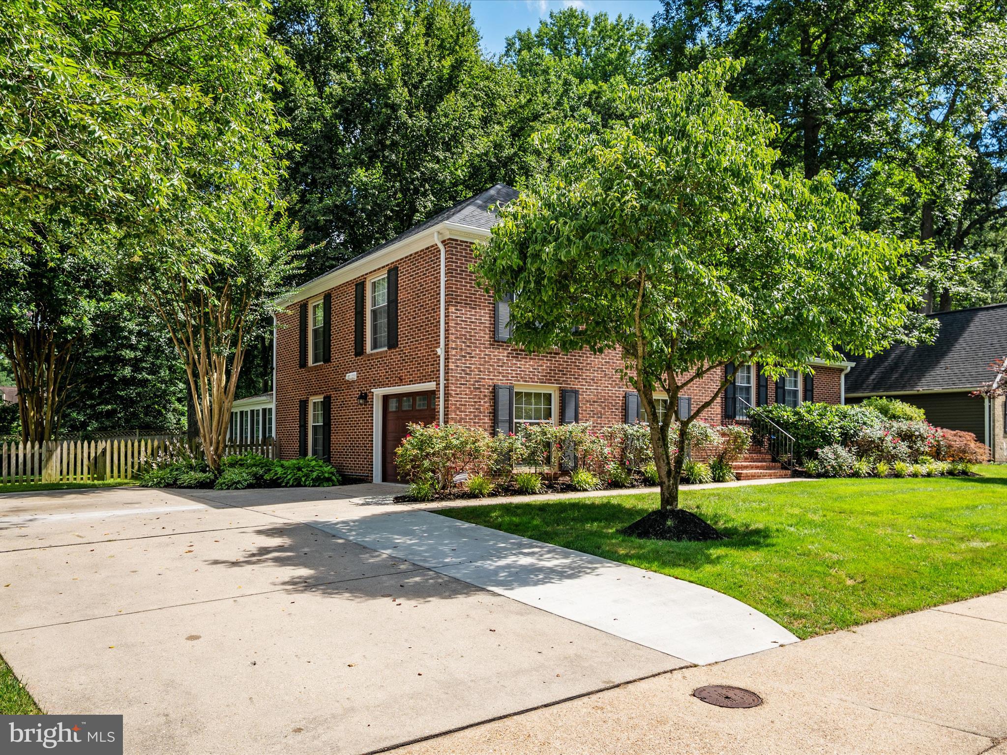 1589 Crofton Parkway Crofton, MD 21114 - Photo 46 of 60 a front view of a house with a yard