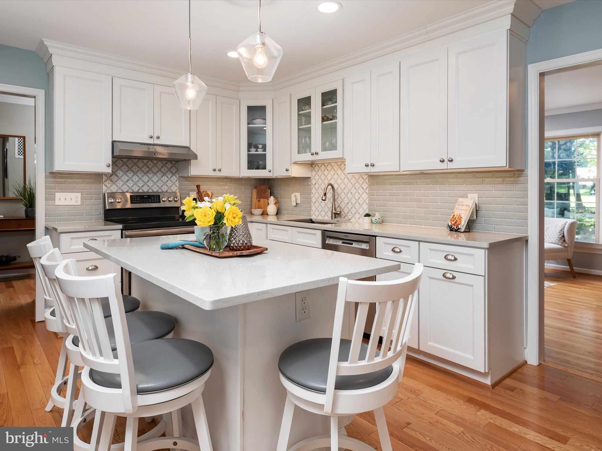 1589 Crofton Parkway Crofton, MD 21114 - Photo 5 of 60 a kitchen with a dining table chairs and microwave