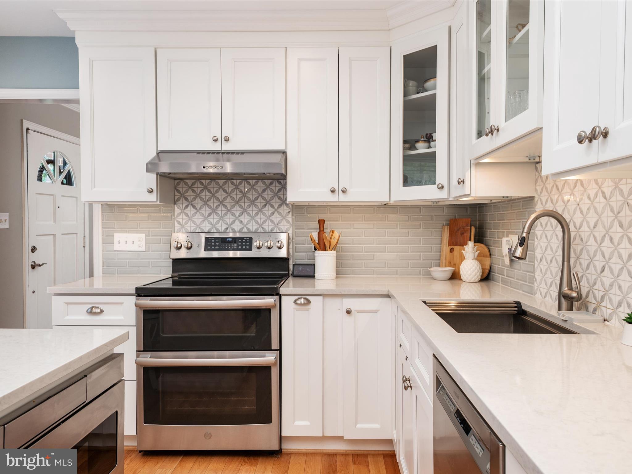1589 Crofton Parkway Crofton, MD 21114 - Photo 7 of 60 a kitchen with cabinets appliances and a sink