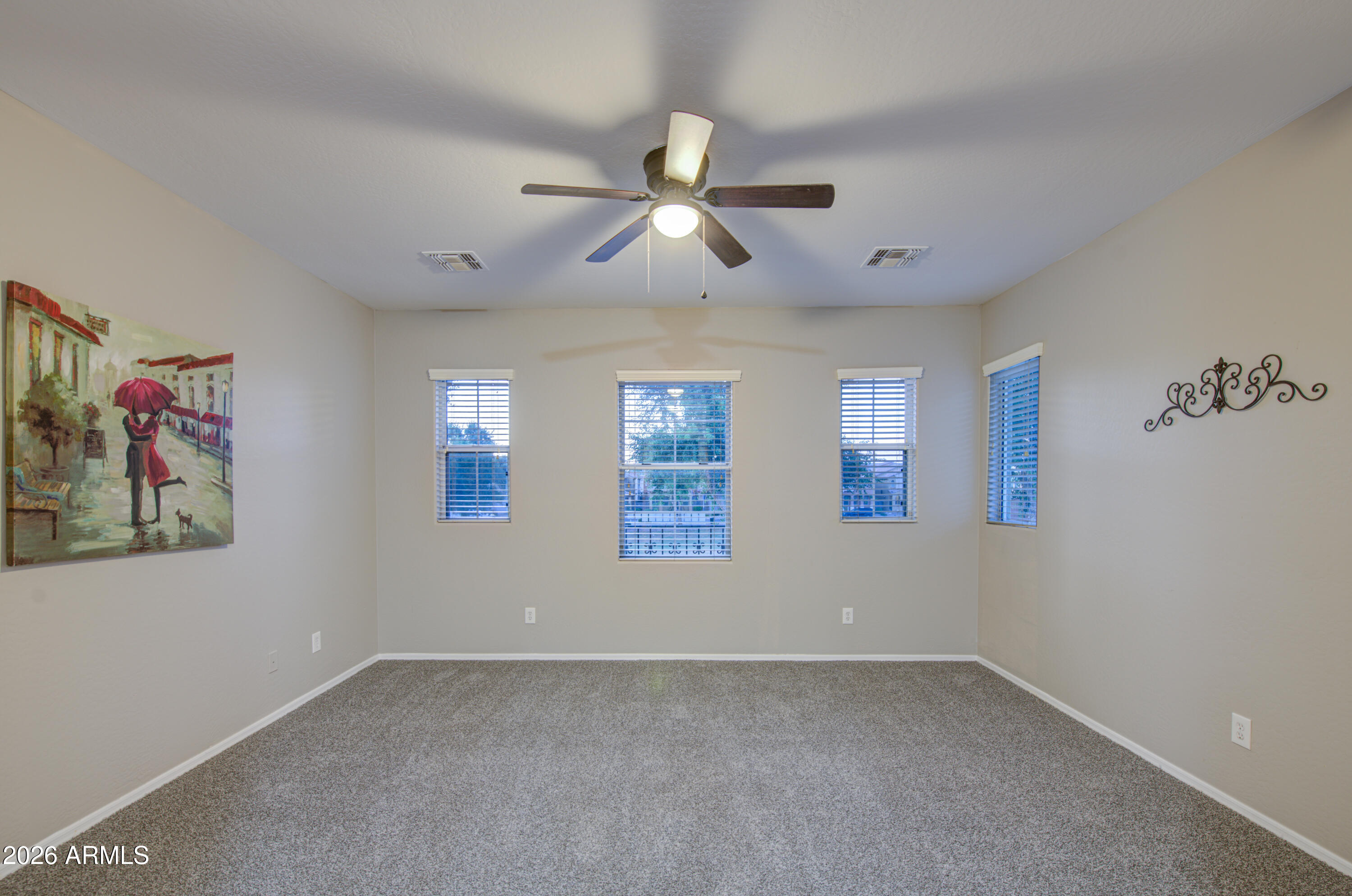7759 West Monte Vista Road Phoenix, AZ 85035 - Photo 19 of 43 wooden floor in an empty room with a window