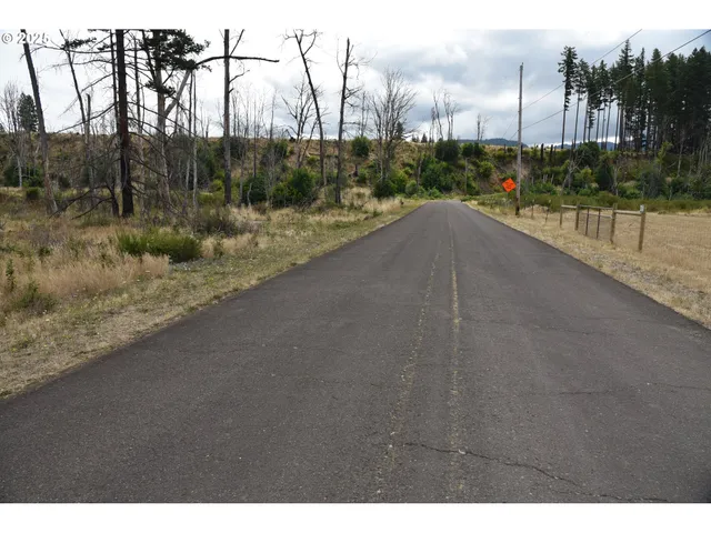 a view of a lake with a yard