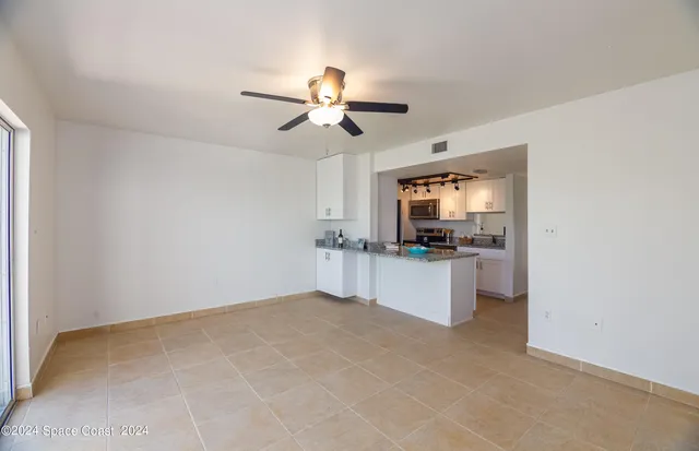 a kitchen with a sink cabinets and appliances