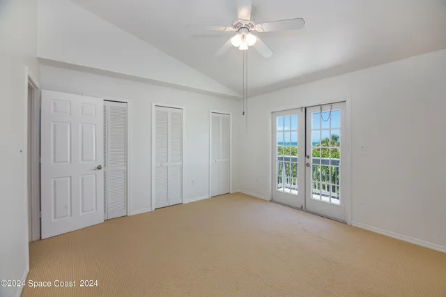 a view of an empty room with glass door