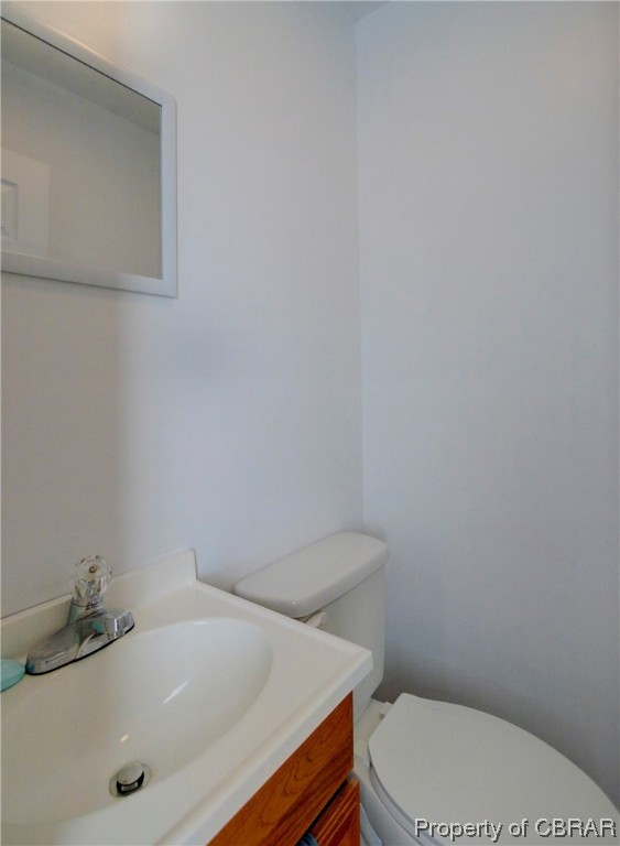 354 Weems Road Weems, VA 22576 - Photo 16 of 24 Bathroom featuring vanity and toilet