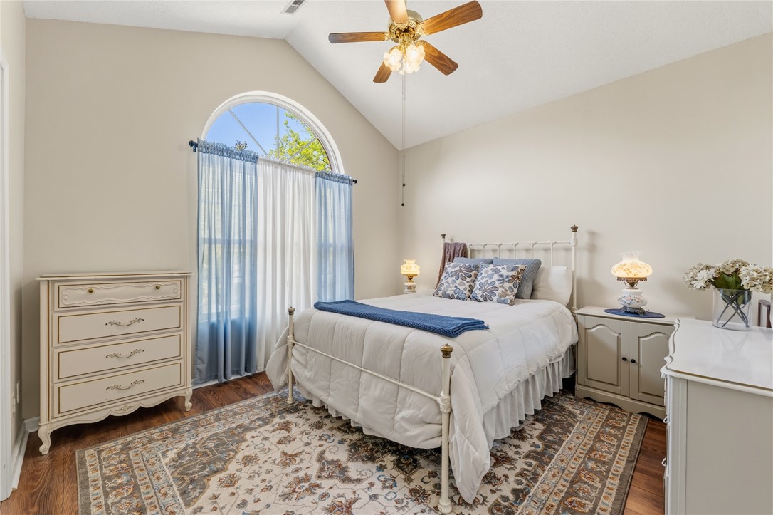 160 Wexford Drive, Unit 206 Anderson, SC 29621 - Photo 24 of 31 Bedroom #2 features an arched window and vaulted ceilings elevating this charming bedroom's natural light.