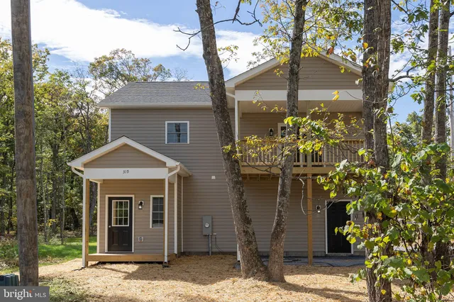 a front view of a house with a porch