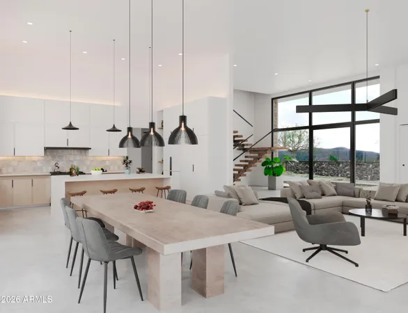 a living room with furniture kitchen view and a potted plant