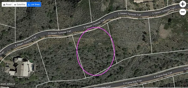 a living room with furniture fireplace and a large window