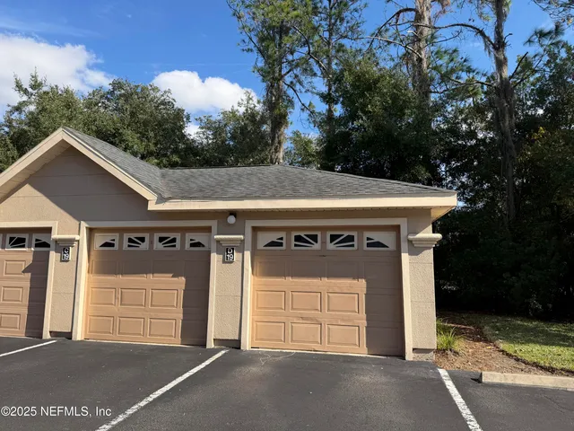 a front view of a house with a garage