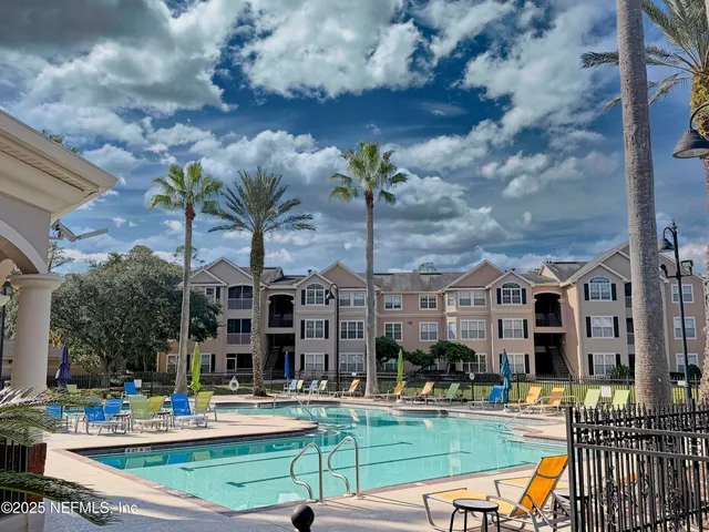 a view of pool with outdoor seating
