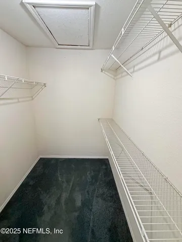 a view of a room with racks on the wall