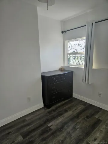 a room with a bed and a window