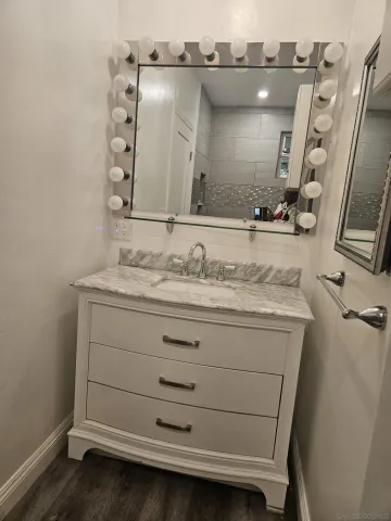 a bathroom with a sink and a mirror