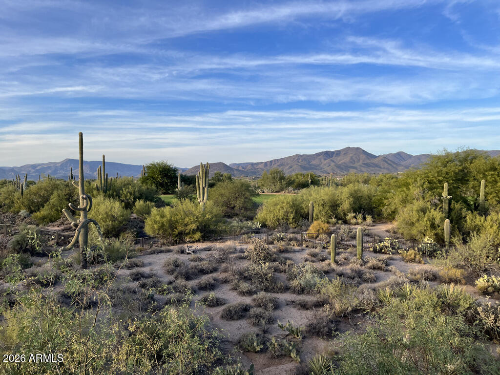 36601 North Mule Train Road, Unit C16 Carefree, AZ 85377 - Photo 37 of 38 a view of a lake with mountains in the background