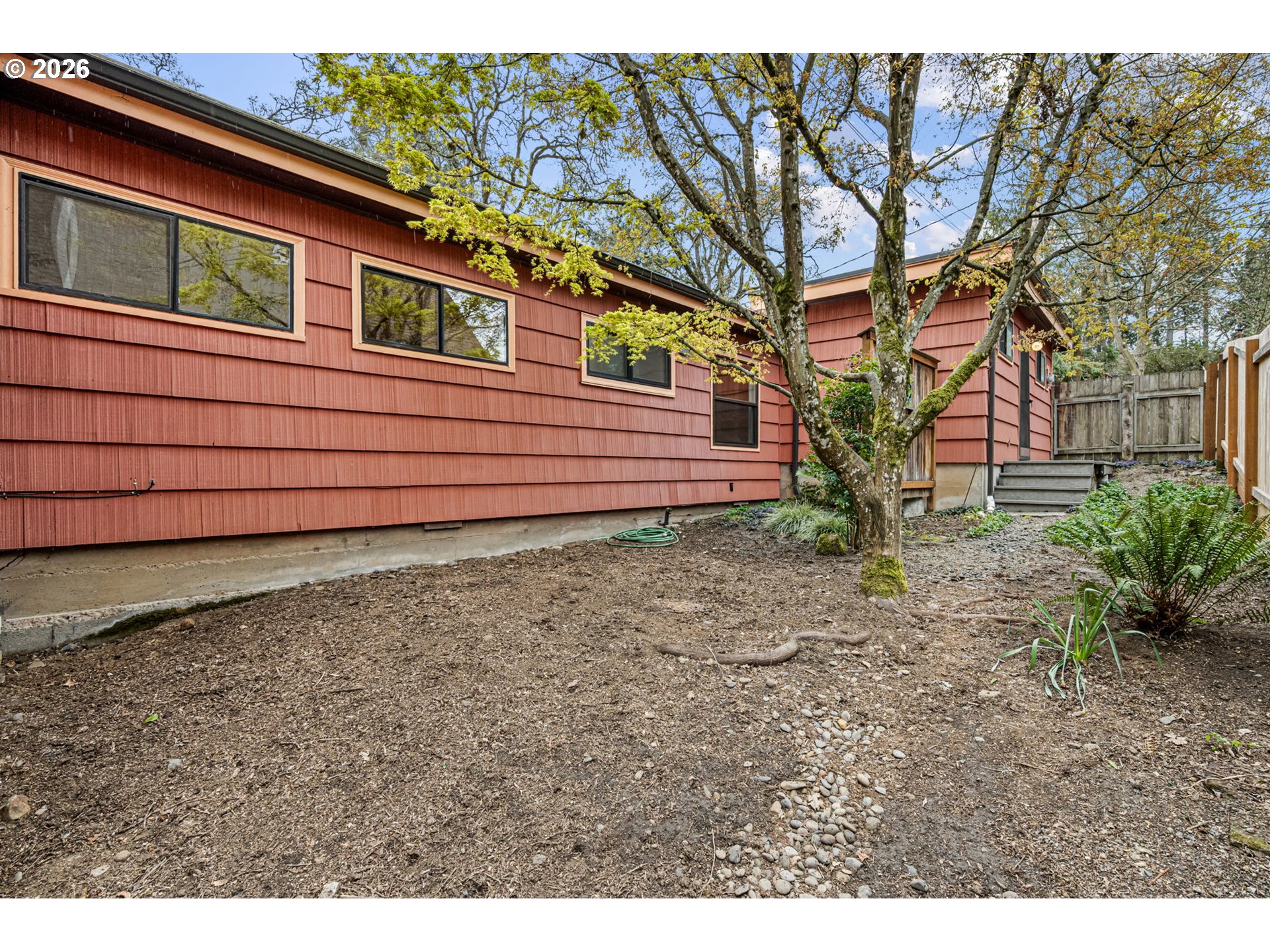 75 West 35th Place Eugene, OR 97405 - Photo 13 of 48 a view of a backyard with large trees