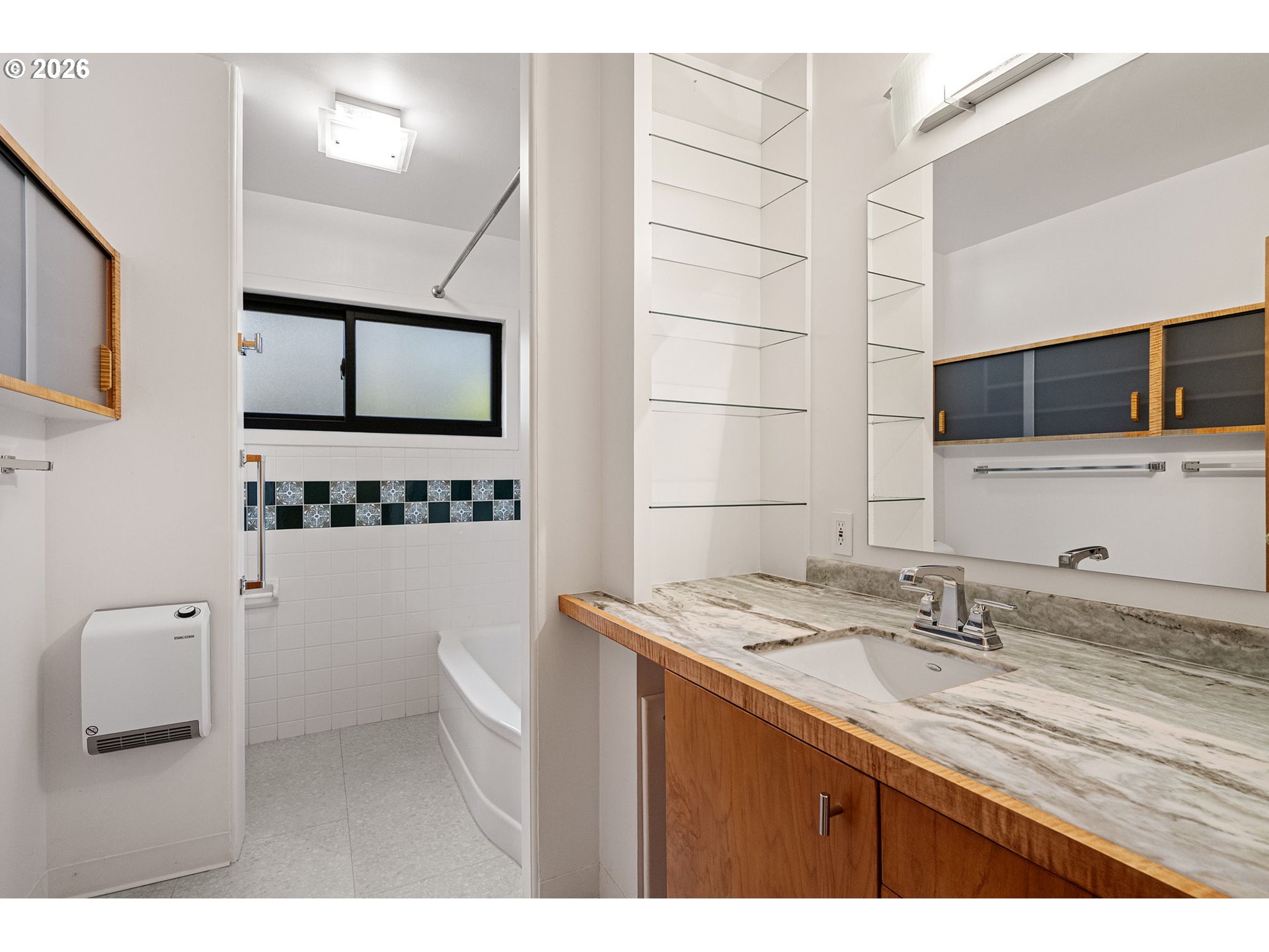 75 West 35th Place Eugene, OR 97405 - Photo 24 of 48 a bathroom with a sink a toilet and mirror