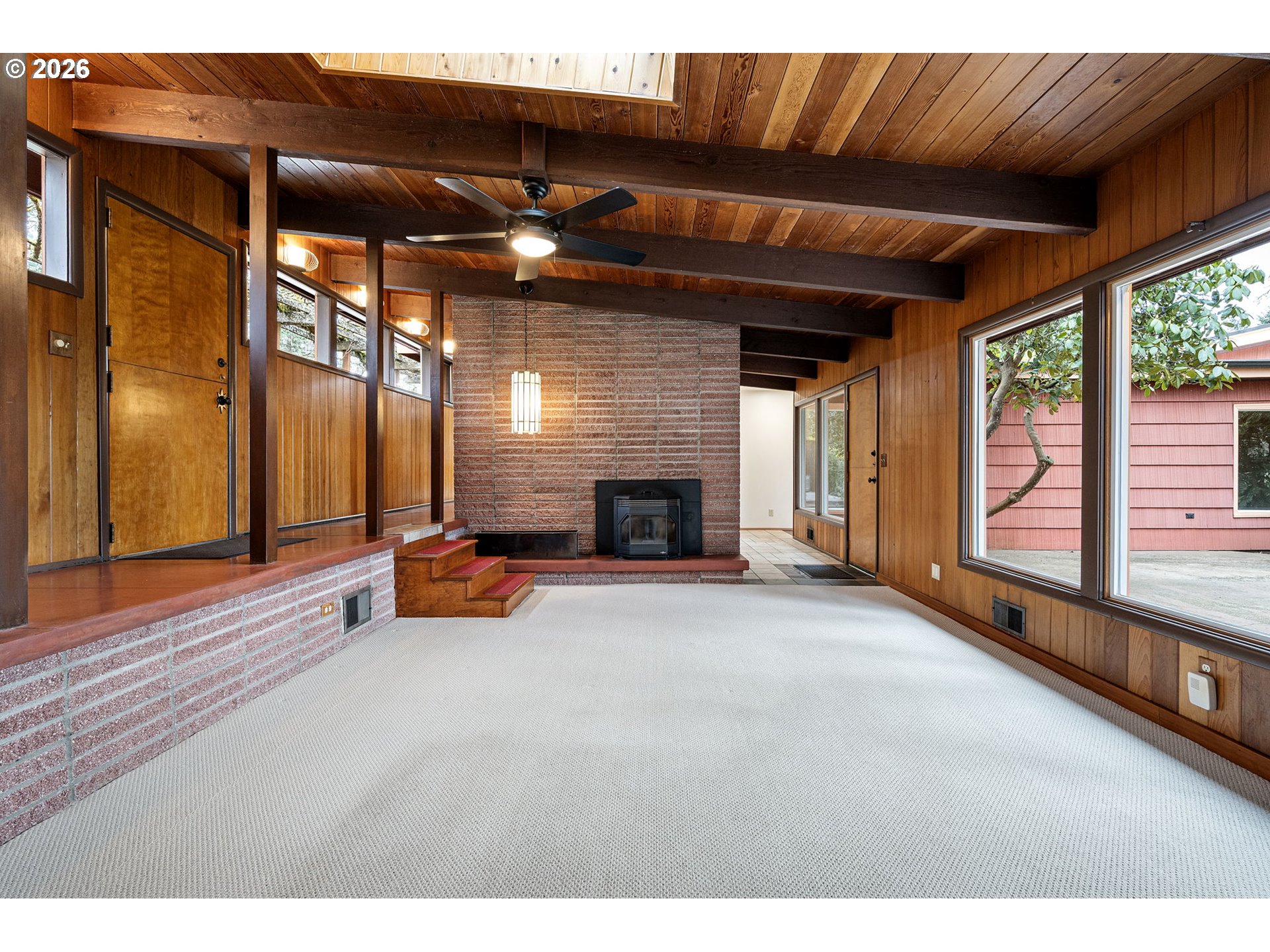 75 West 35th Place Eugene, OR 97405 - Photo 3 of 48 a view of a livingroom with fireplace and a window