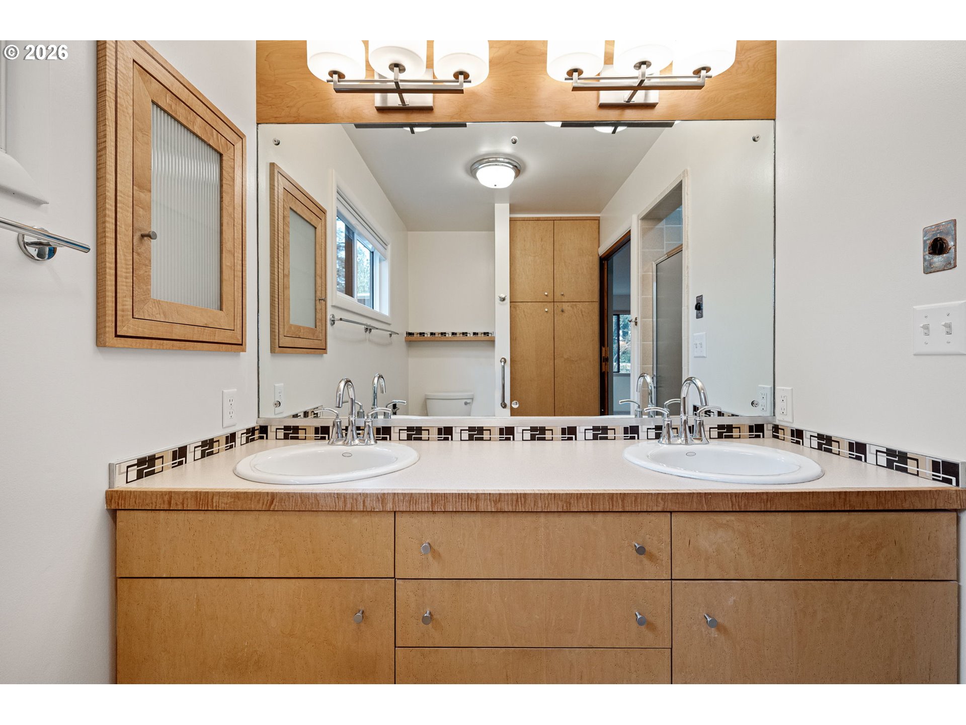 75 West 35th Place Eugene, OR 97405 - Photo 33 of 48 a bathroom with a sink vanity and a mirror