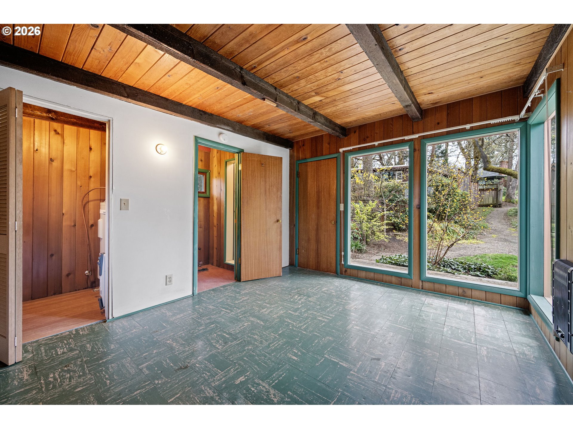 75 West 35th Place Eugene, OR 97405 - Photo 43 of 48 an empty room with wooden floor and windows
