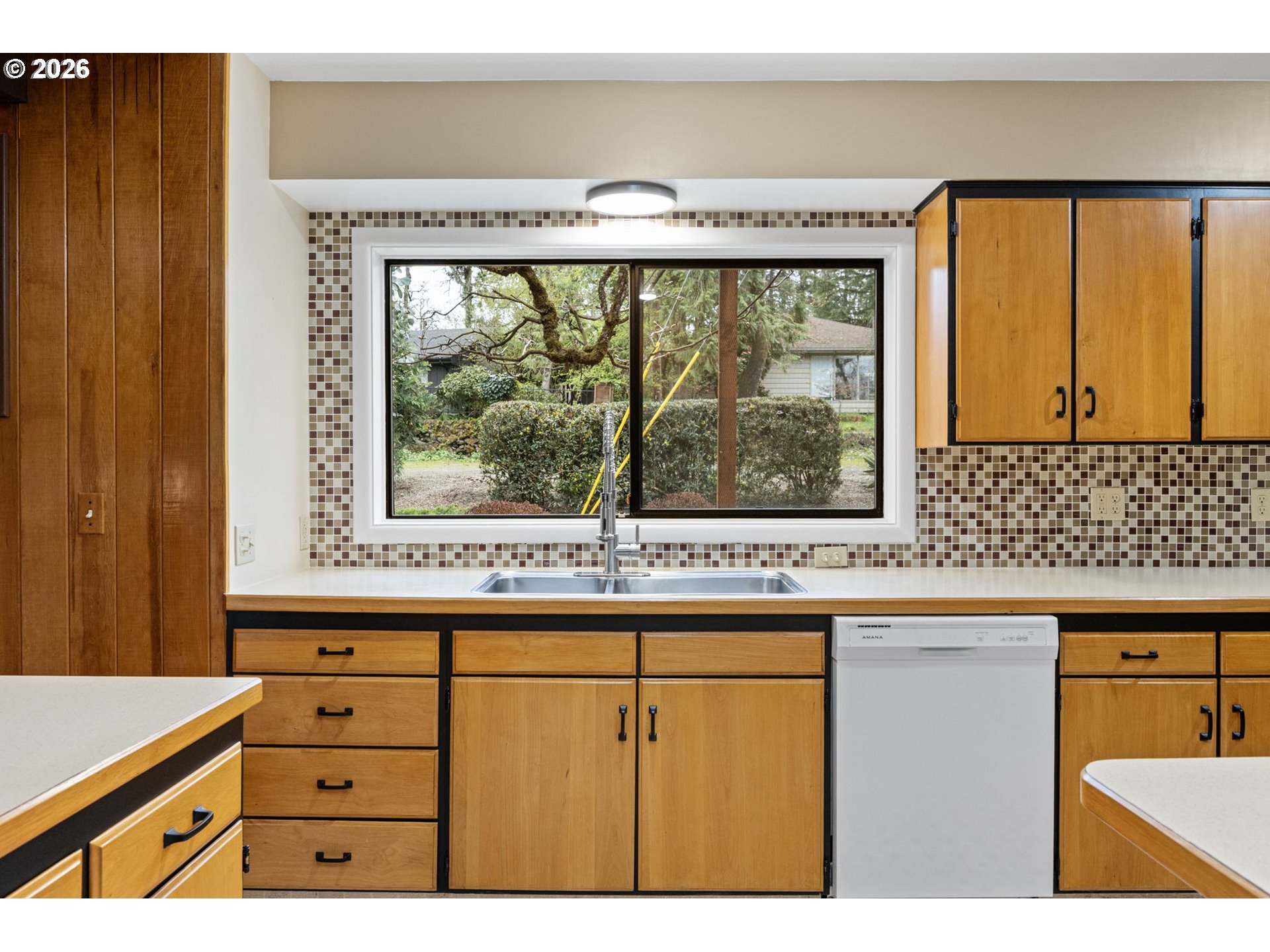75 West 35th Place Eugene, OR 97405 - Photo 9 of 48 a kitchen with a window and a sink