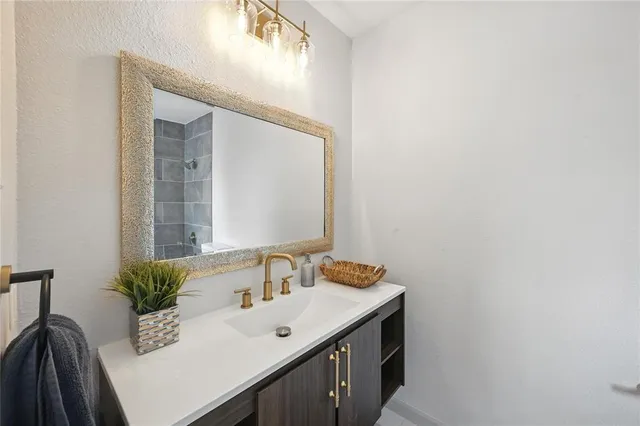 a bathroom with a sink and a mirror