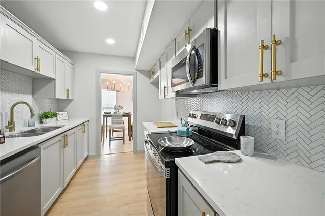 a kitchen with a stove and a sink