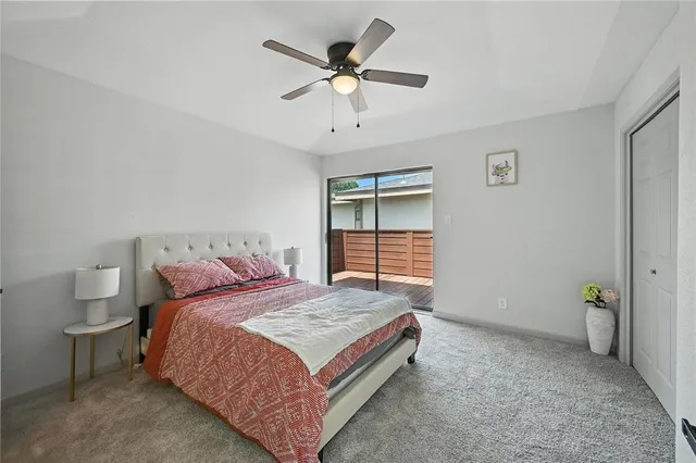 a spacious bedroom with a bed and a window