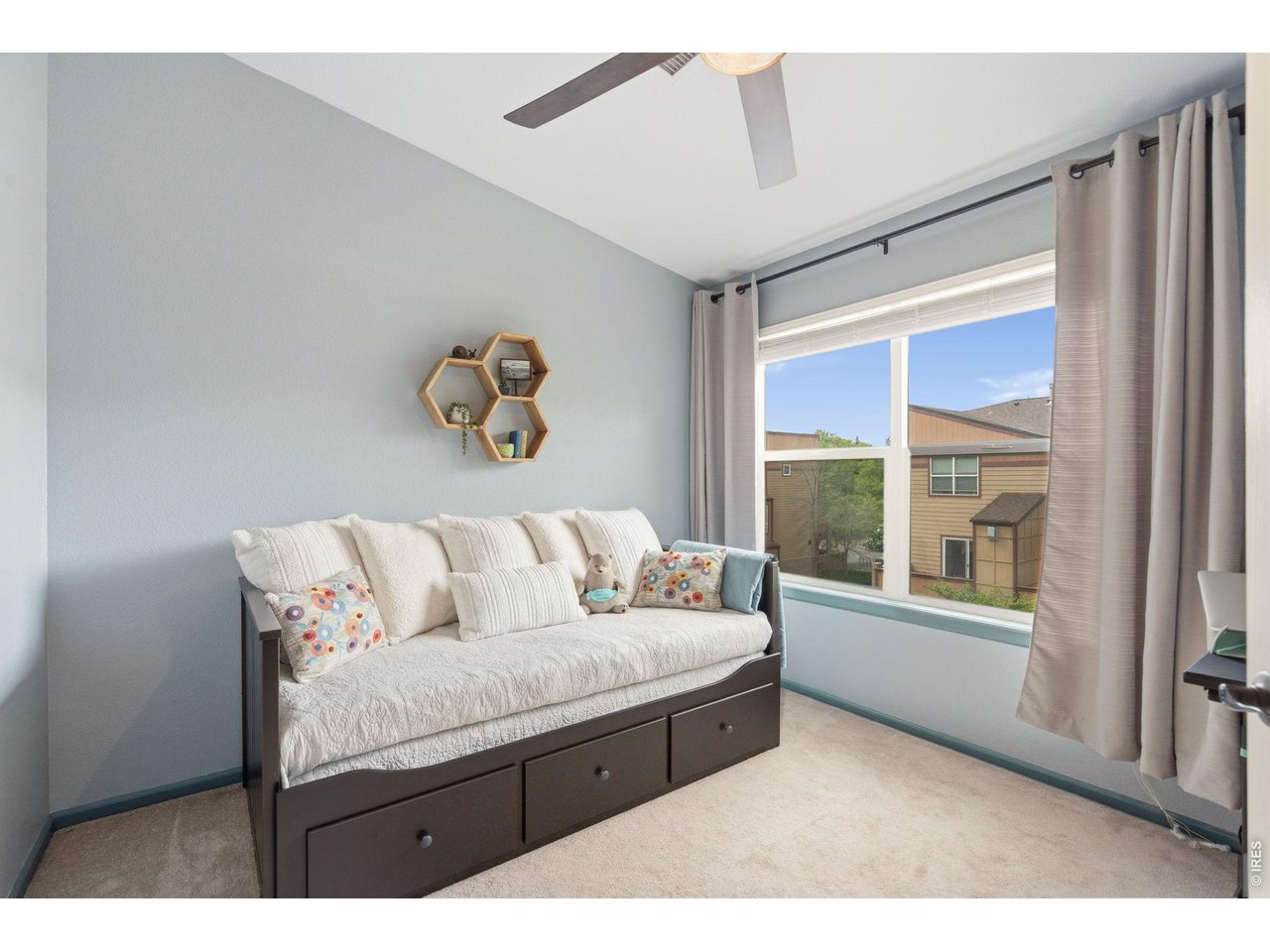 1221 East Prospect Road, Unit 3 Fort Collins, CO 80525 - Photo 26 of 37 Bedroom #2 is light and bright with vaulted ceilings.