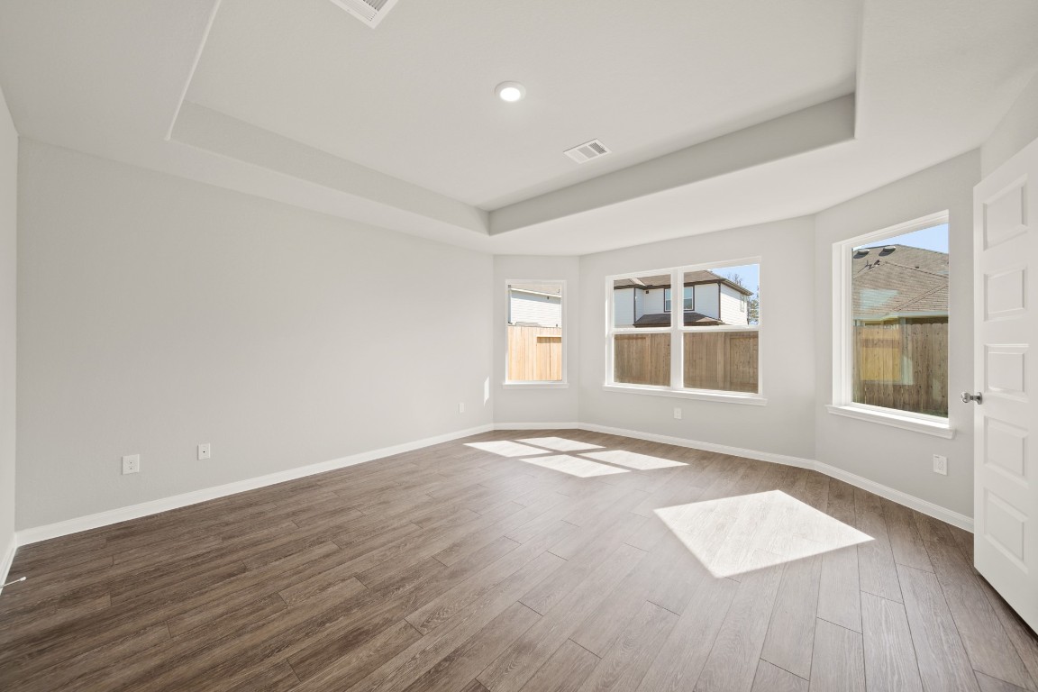 13655 Kit Run Splendora, TX 77372 - Photo 11 of 25 a view of an empty room with wooden floor and a window