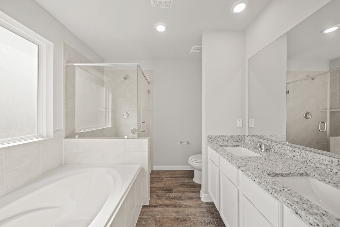 13655 Kit Run Splendora, TX 77372 - Photo 12 of 25 a bath room with a granite countertop sink and a bathtub
